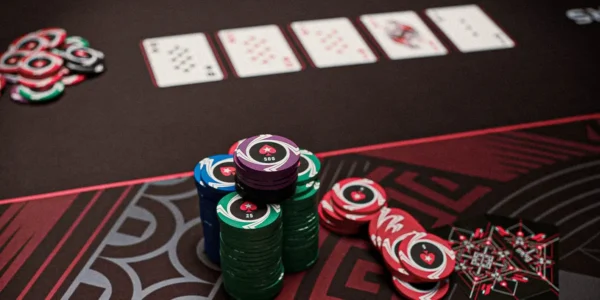 Close-up of poker chips and cards representing PLO strategy concepts