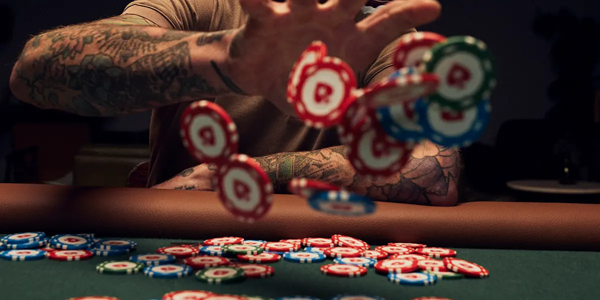 Poker player throwing chips in frustration, representing emotional tilt and loss of control