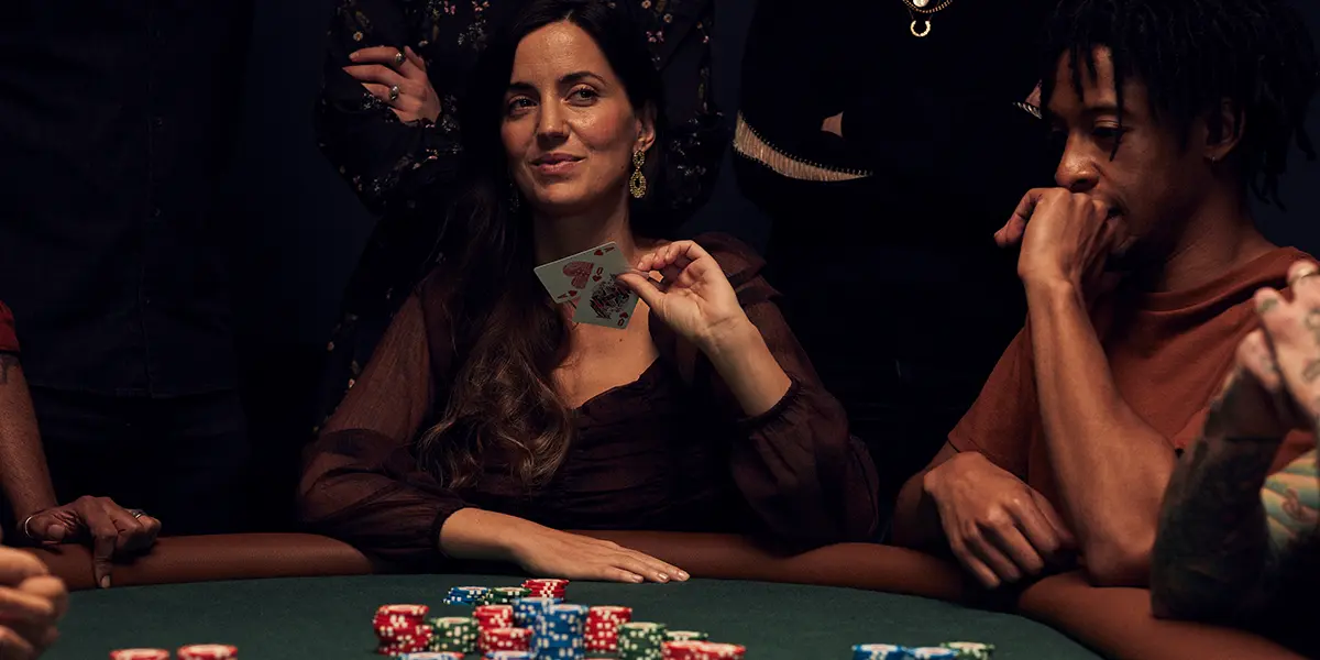 Poker player reveals AQs at the table to influence a reactive opponent’s decisions.