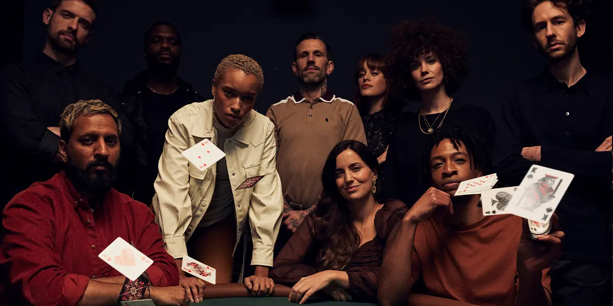 A group of poker players preparing for a poker tournament