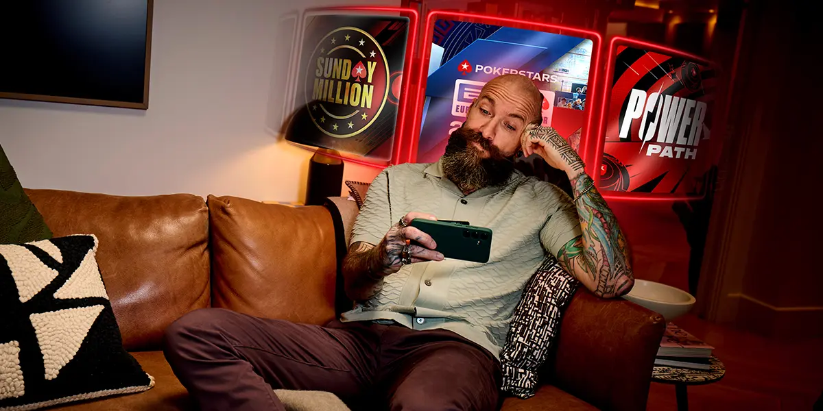 Poker player selecting a PokerStars game on his mobile