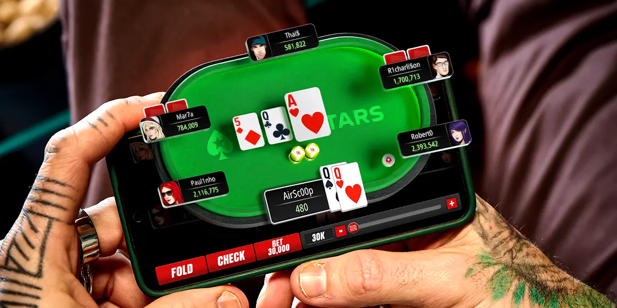 Poker player playing a tournament on PokerStars on his mobile