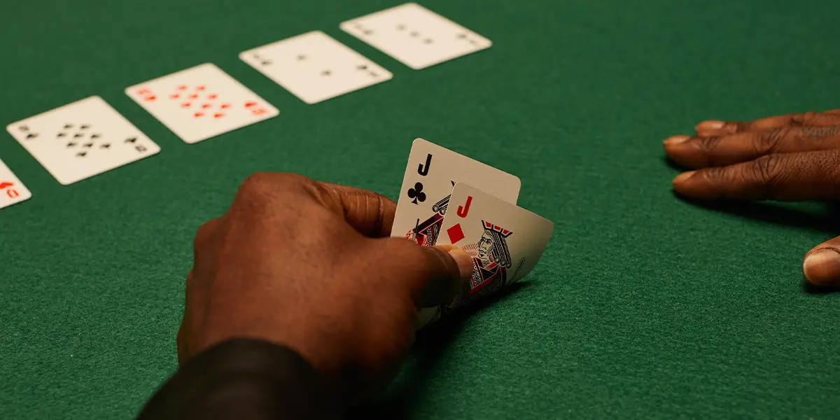 A professional poker player looking intensely at the table, representing the practice of hand reading and range analysis.
