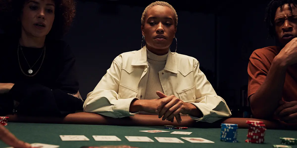 Poker player analyzing the board with a flopped set.