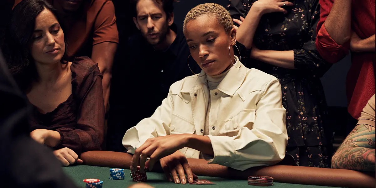 Concentrated poker player calculating pot odds against a short stack.
